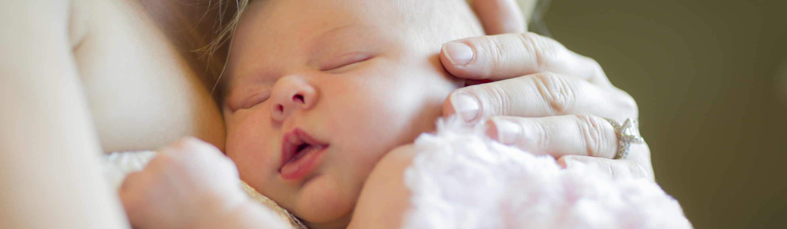 Cute sleeping baby on mom's chest, clients of Bethesda Placenta Encapsulation