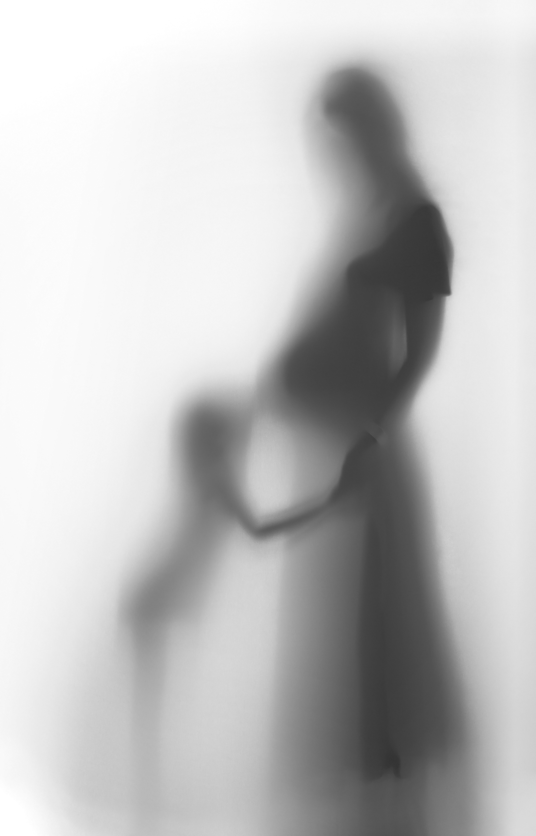silhouette of pregnant mother and child wondering about the baby blues